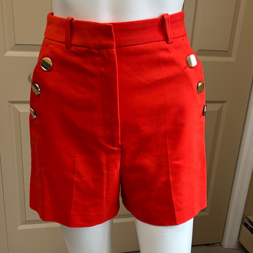 ZARA orange shorts with gold tone buttons
